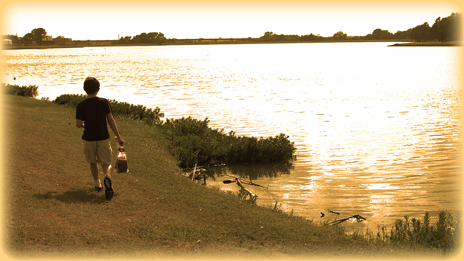 My son feeding ducks leftover bread at Bachman Lake in Dallas.